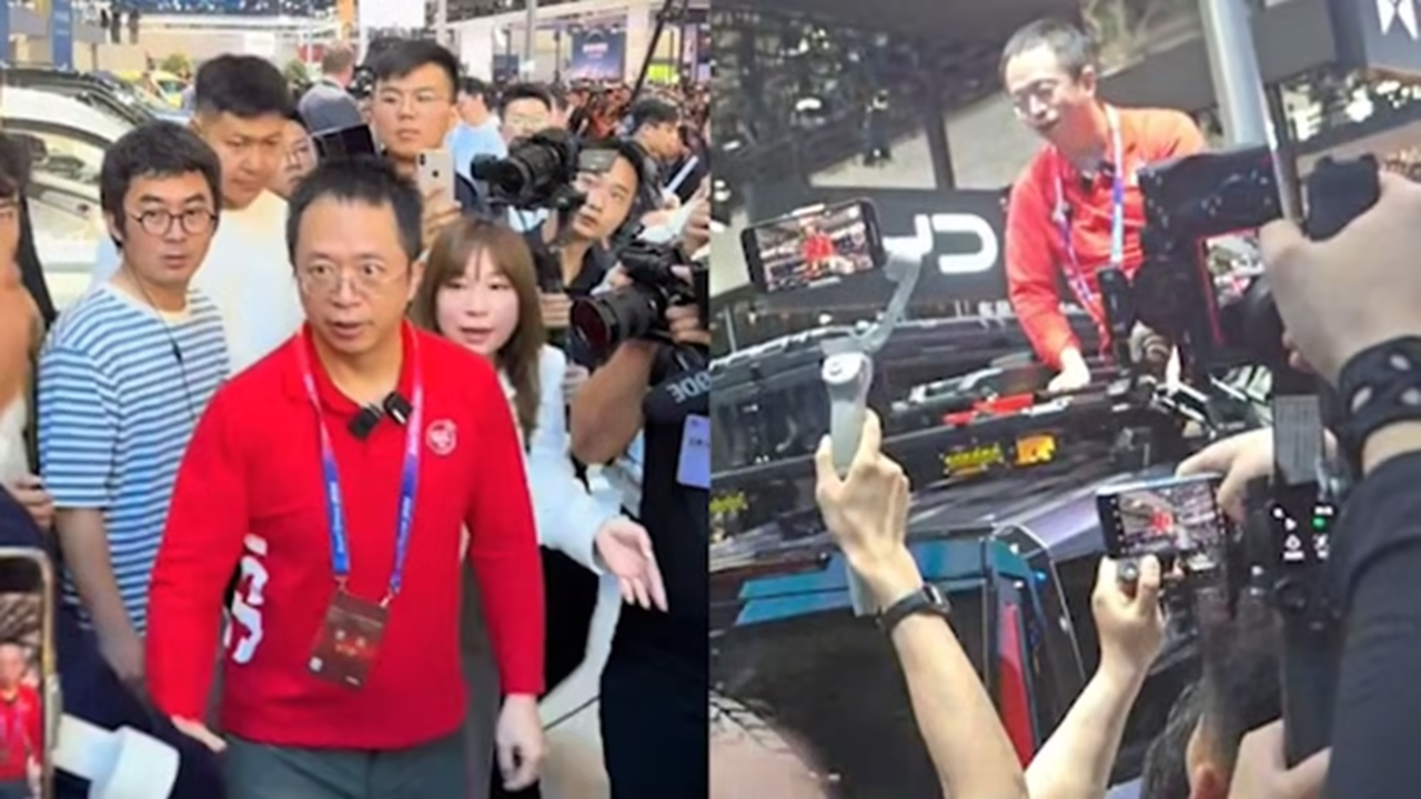 周鸿祎北京车展上爬车顶,幽默证明自己“非数字人”